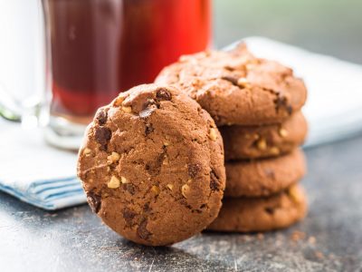 Tasty chocolate cookies. Tasty chocolate cookies on old kitchen table.